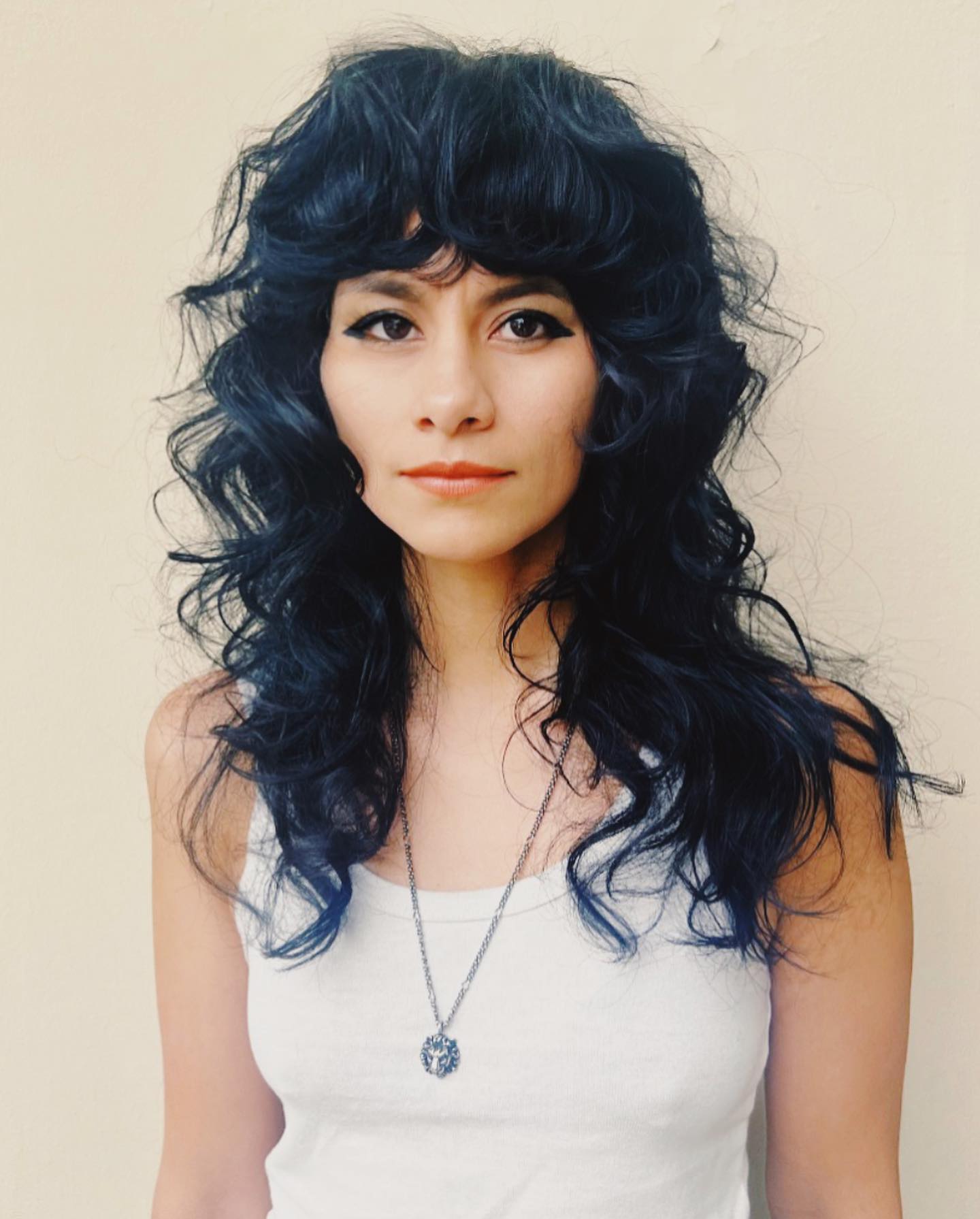 Bold Midnight Blue Curly Wolf Cut with Voluminous Bangs