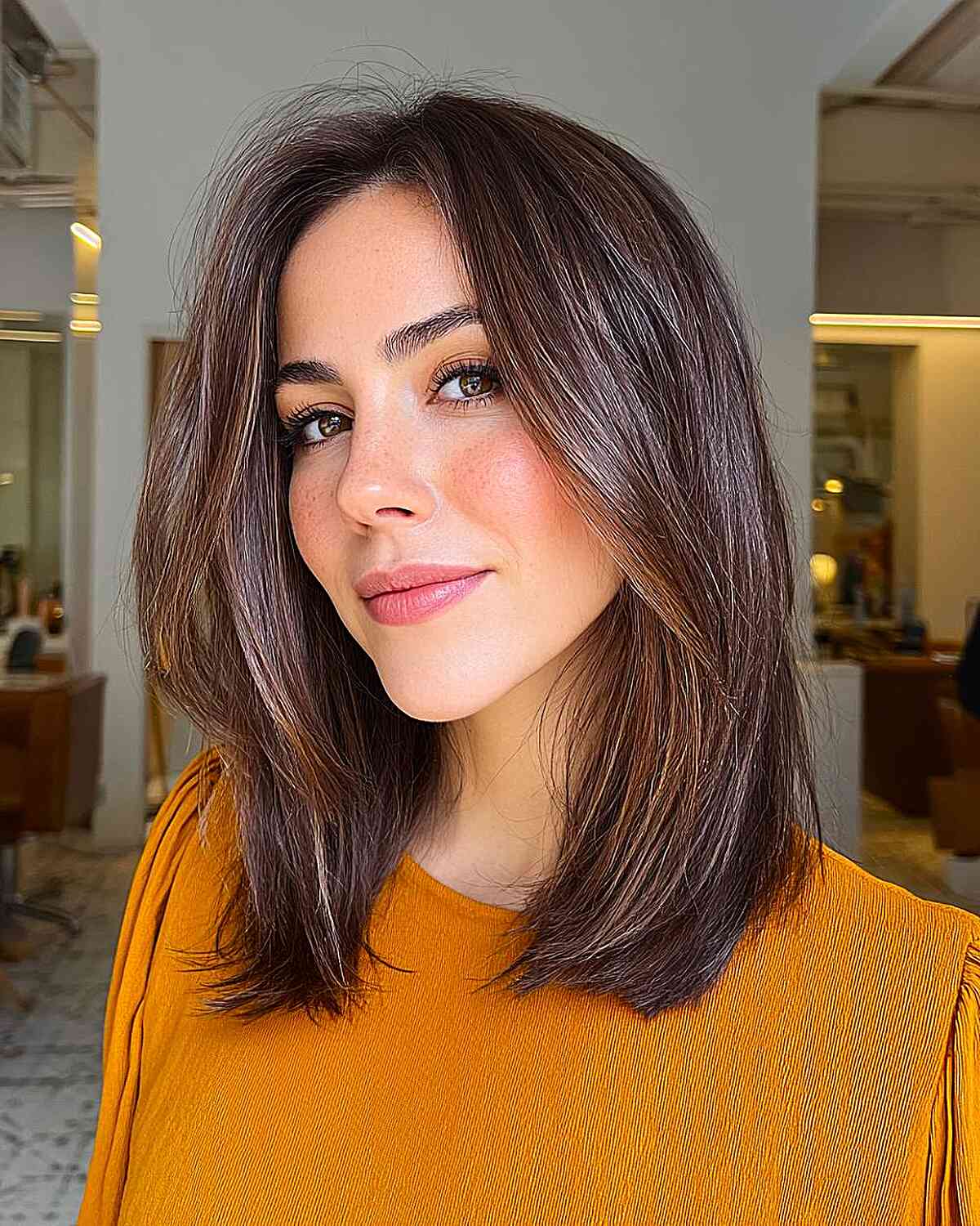 Modern Long Layered Cut with Subtle Highlights
