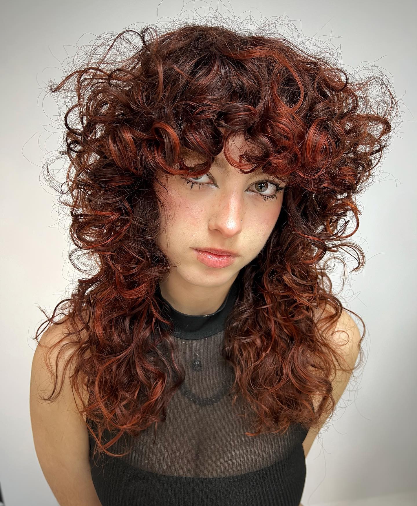 Rich Auburn Curly Wolf Cut with Defined Ringlets