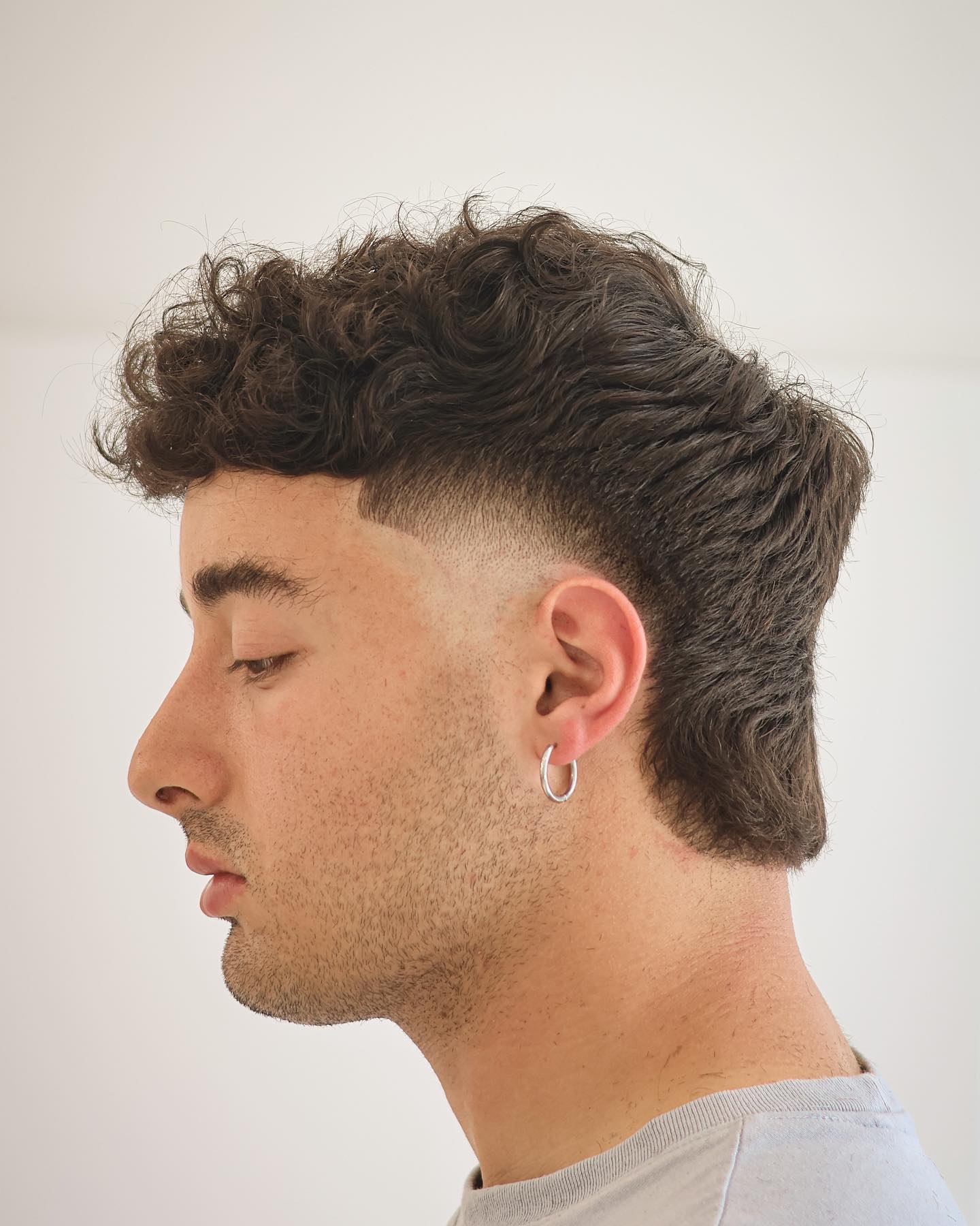 Textured Curly Mohawk with Clean Fade