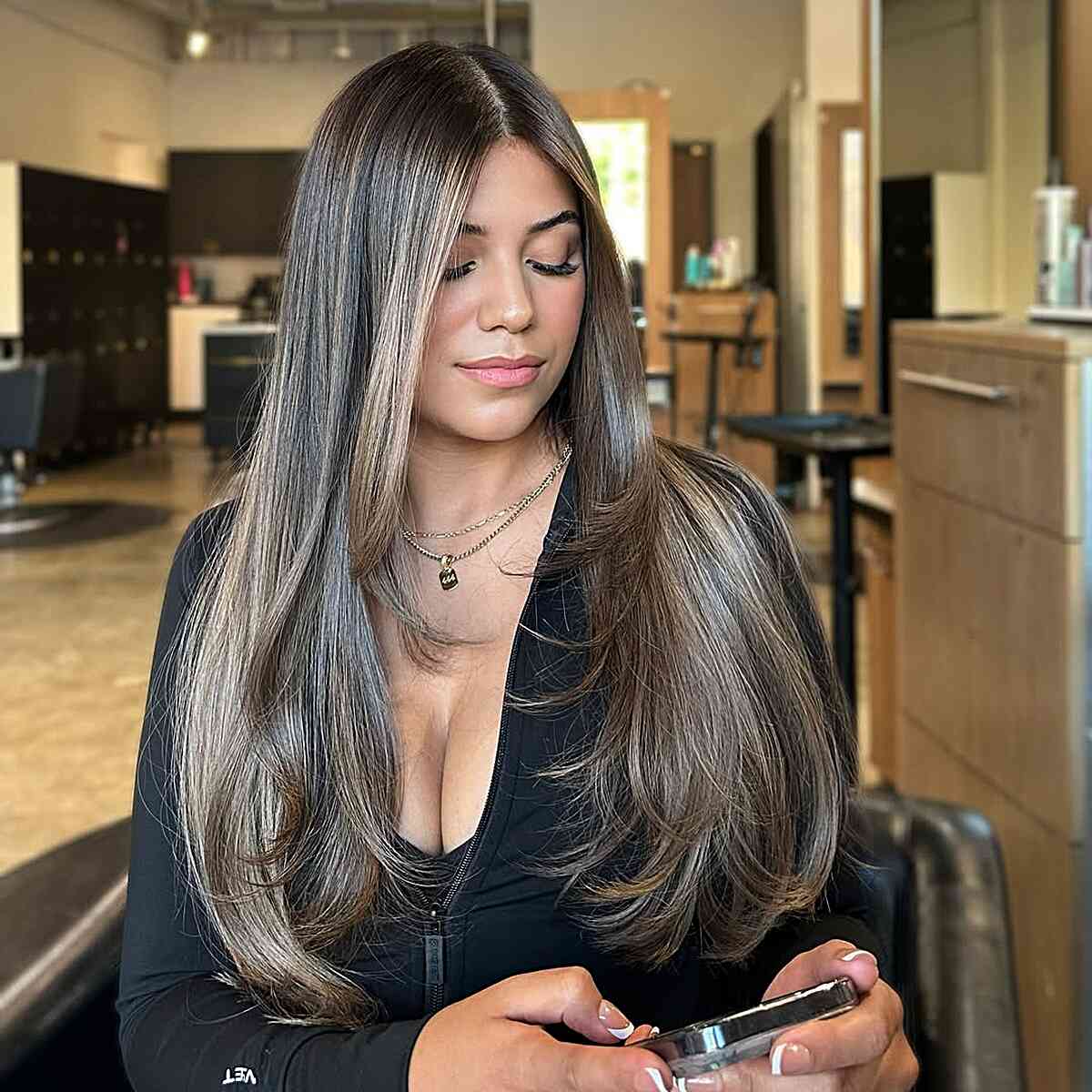 Sleek Long Layered Hairstyle with Subtle Highlights