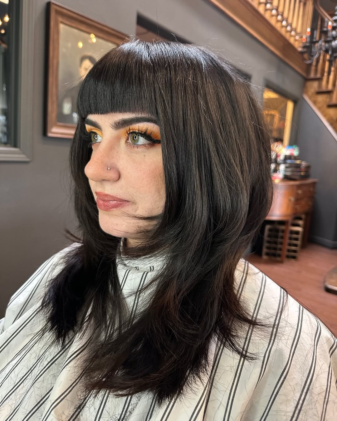 Midnight Black Layered Bob with Blunt Bangs