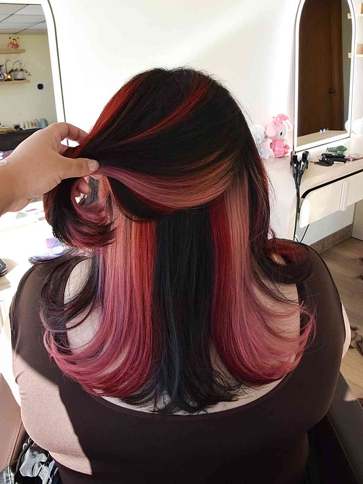 Bold Peekaboo Pink and Black Layered Haircut