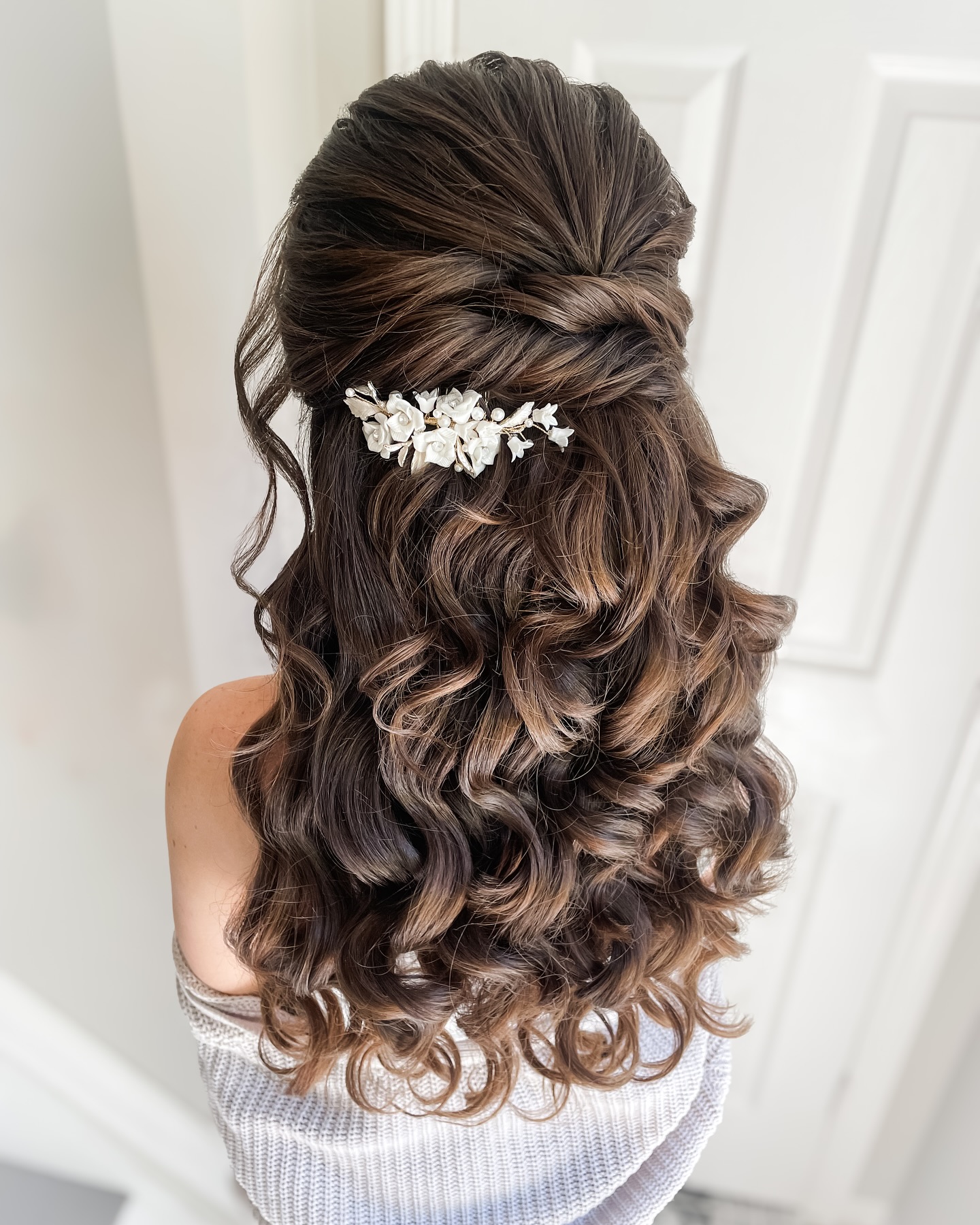  Twisted Cascade Half Updo with Floral Accents 