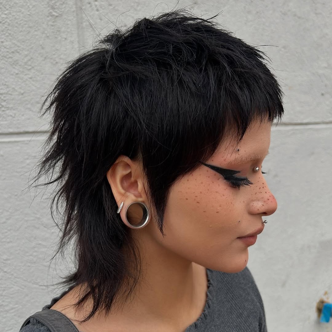 Edgy Black Textured Pixie with Long Bangs