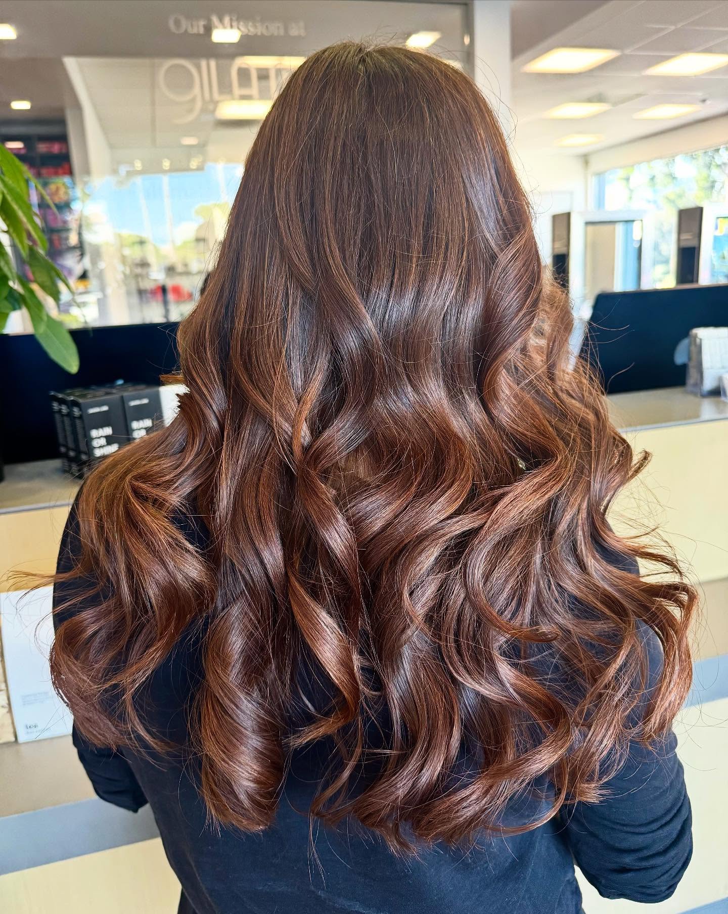 Luxurious Chestnut Waves with Copper Highlights