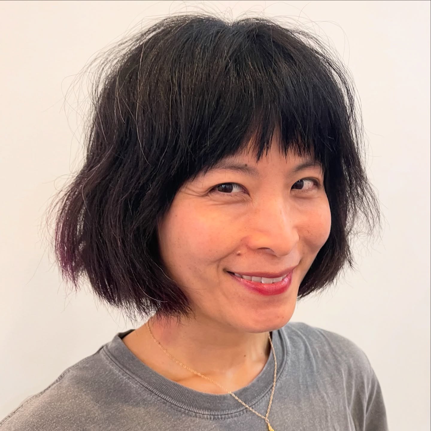 Charming Asymmetrical Bob with Subtle Purple Highlights