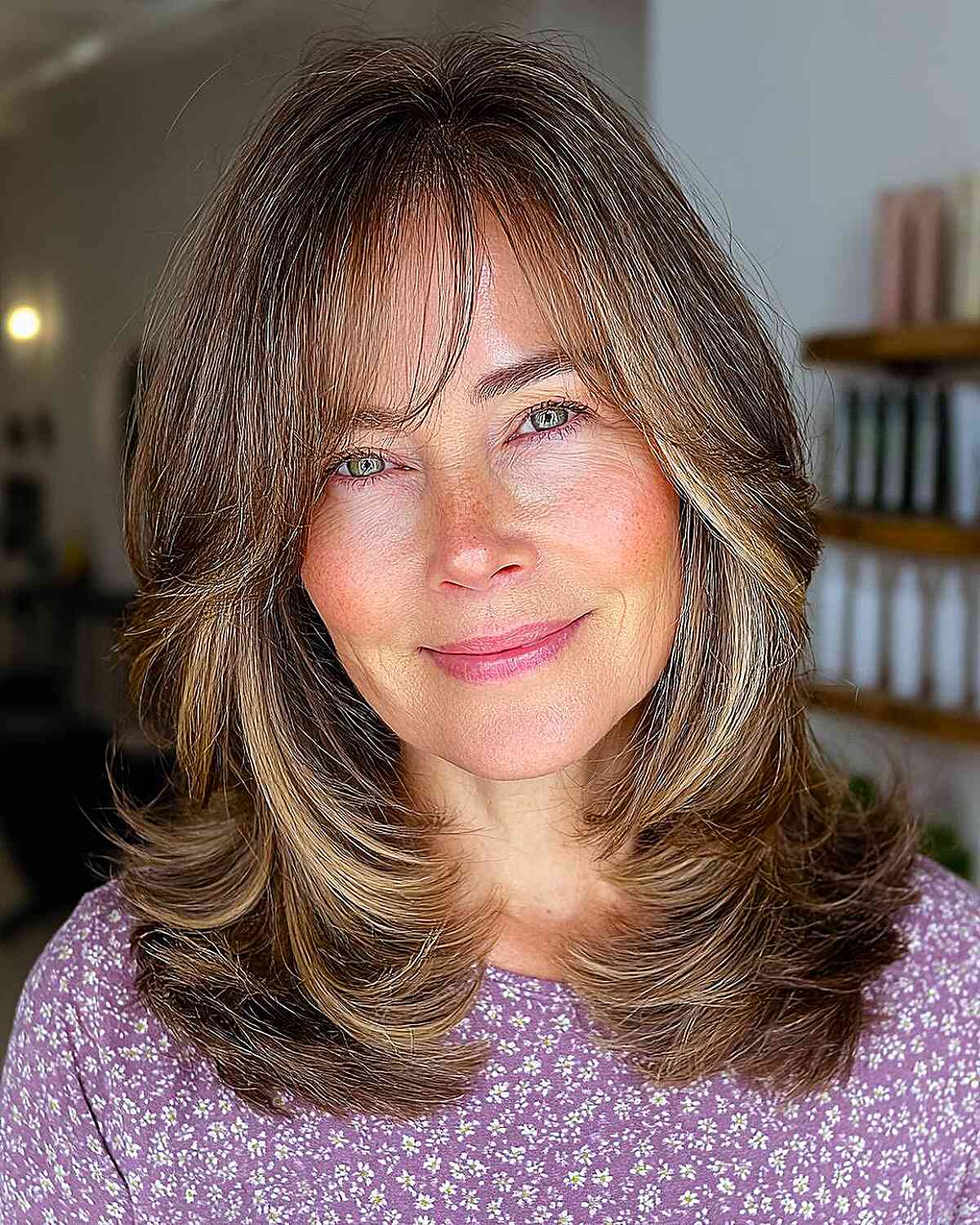 Choppy Layered Haircut with Soft Face-Framing Bangs