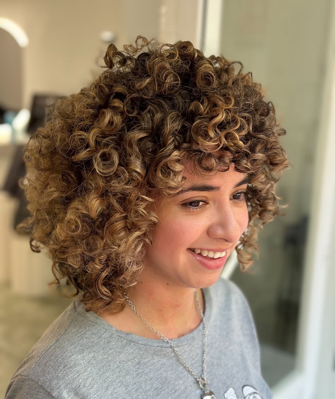 Golden-Toned Corkscrew Curly Bob with Subtle Layering
