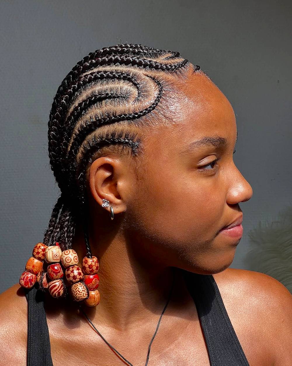 Intricate Curved Cornrow Braids with Beaded Accents