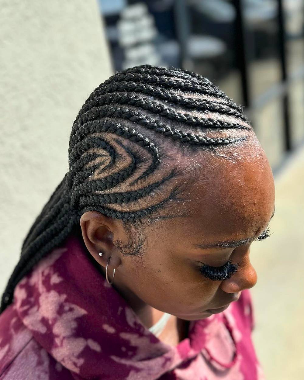 Intricate Curved Cornrow Braids with Defined Patterns