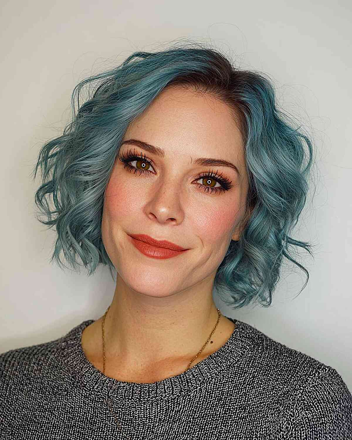 Playful Teal Curly Bob