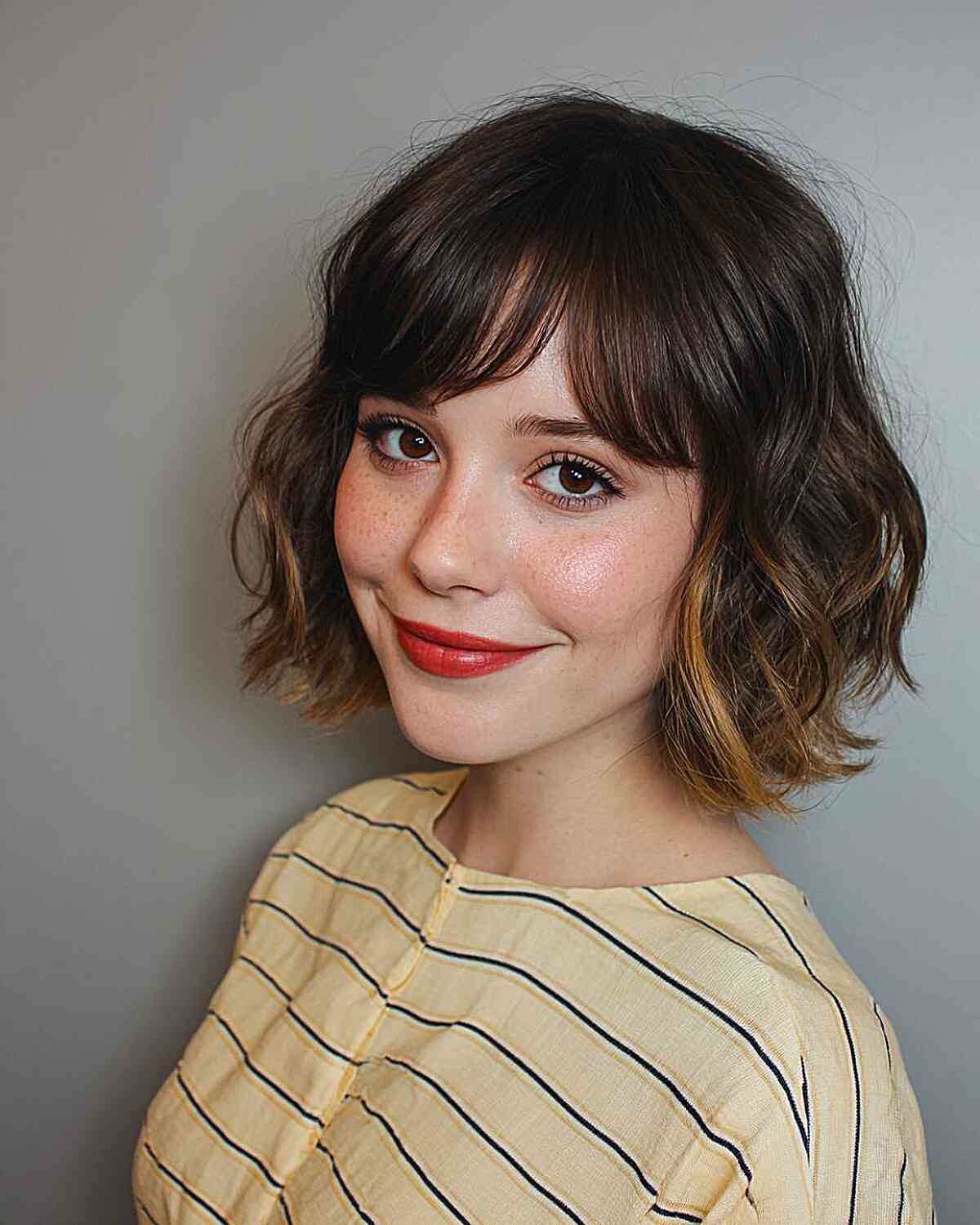 Textured Brown Wavy Bob with Subtle Highlights