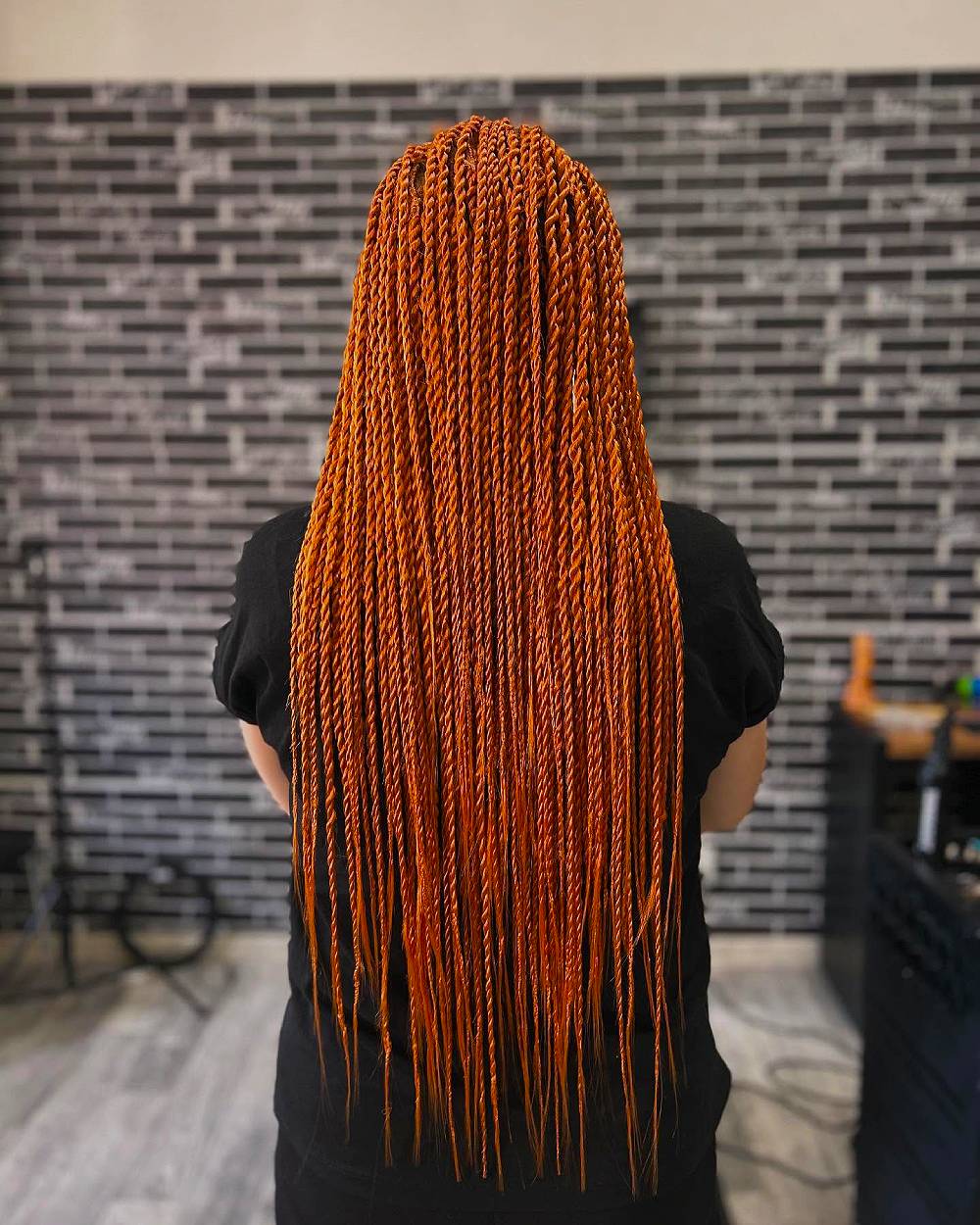 Vibrant Long Twisted Braids with a Bold Orange Hue