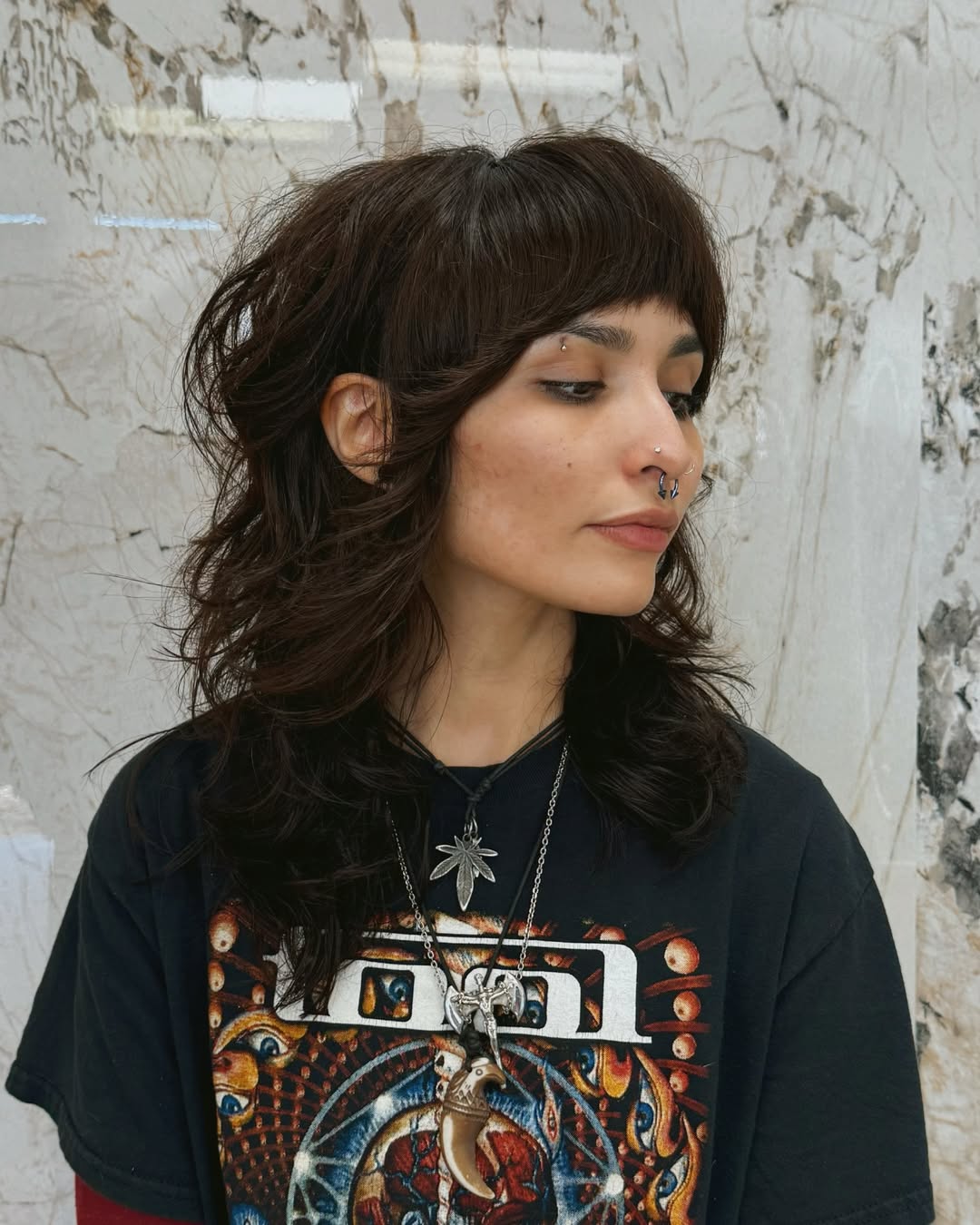 Chic Brunette Shag with Subtle Highlights and Wispy Bangs