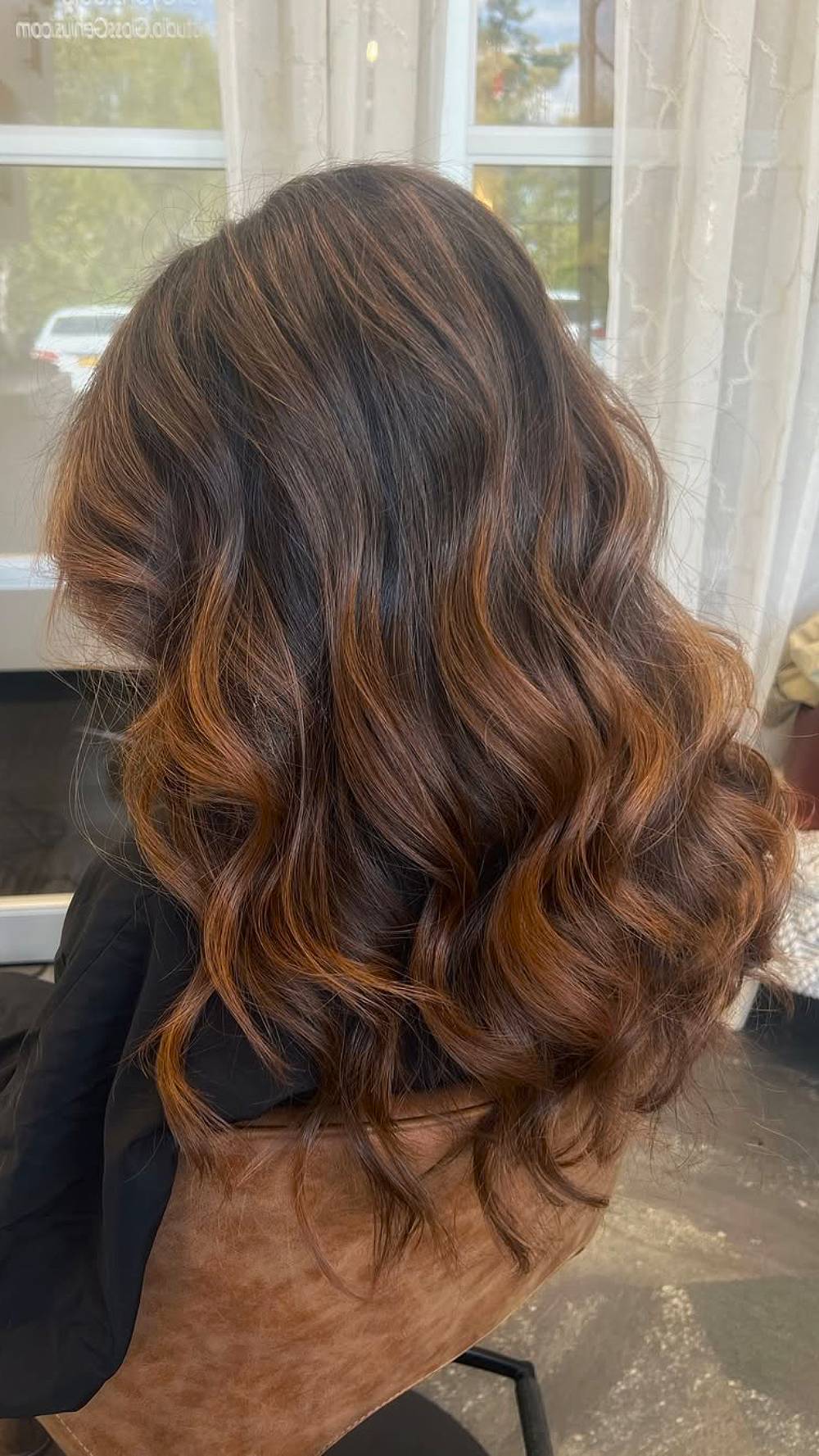 Chic Layered Brunette Locks with Subtle Highlights