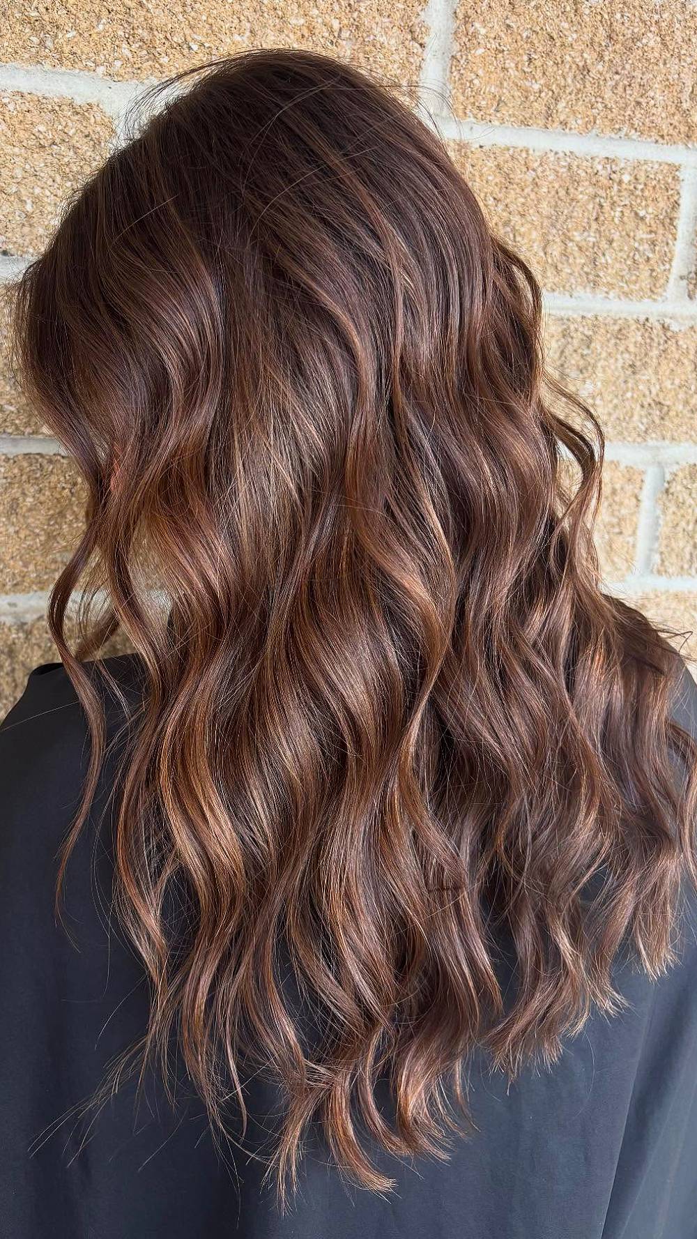 Softly Layered Brunette Waves with Warm Highlights