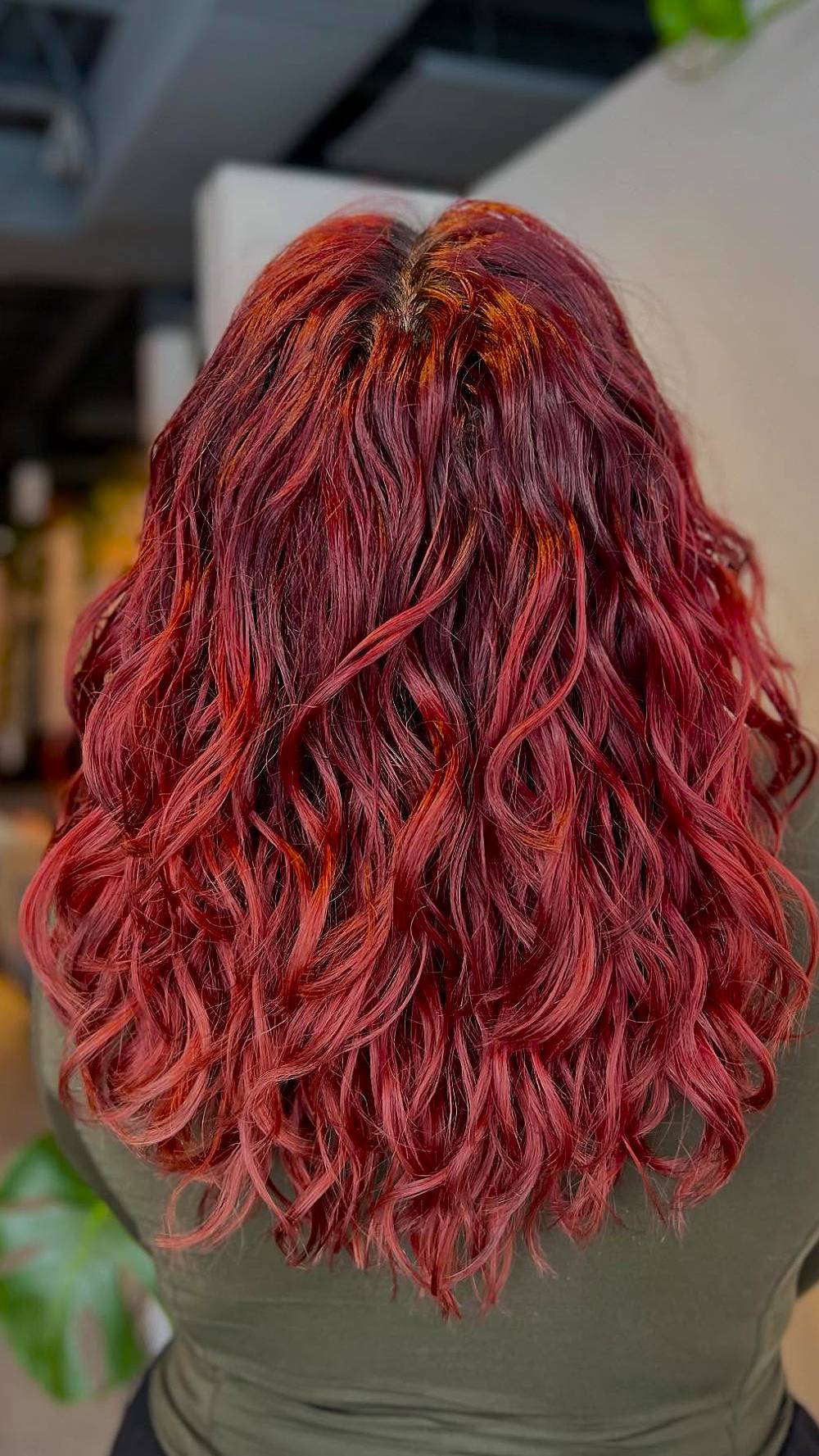 Vibrant Curly Lob with Fiery Highlights