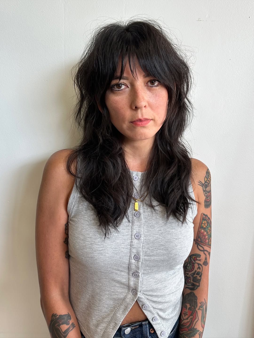 Effortlessly Casual Black Waves with Wispy Bangs