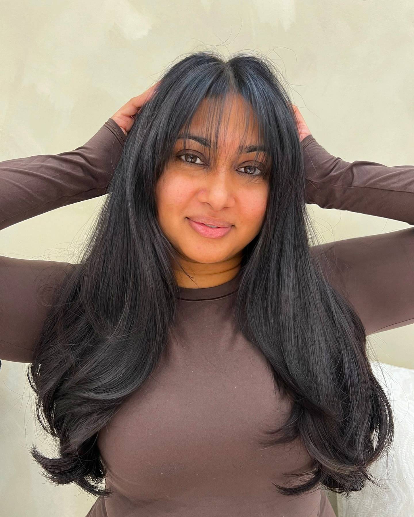 Elegant Long Layers with Wispy Bangs