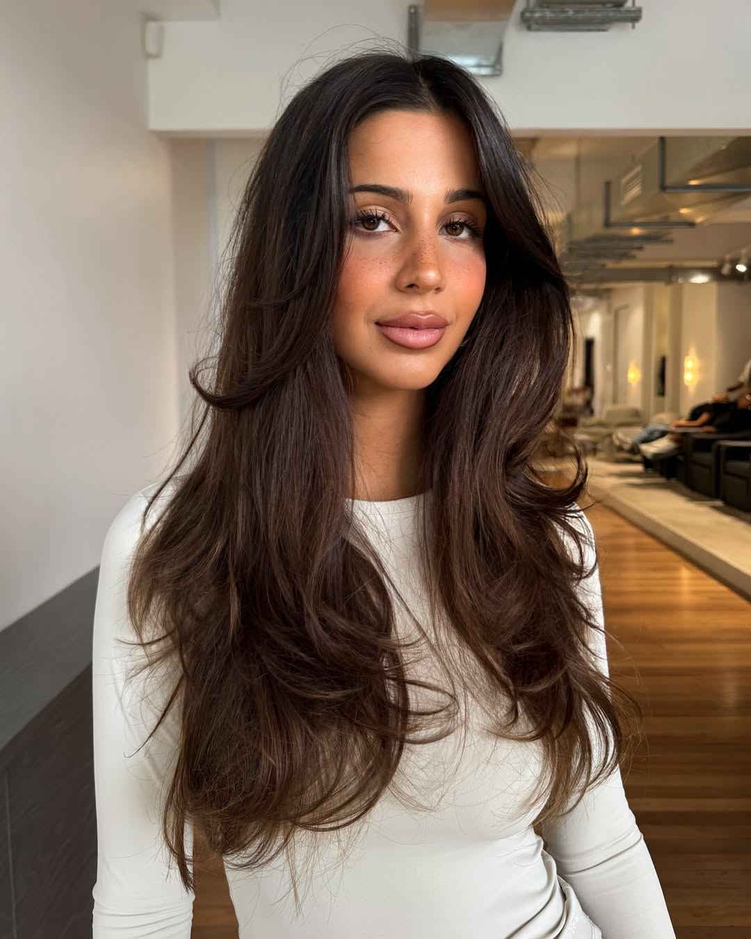 Luxurious Chestnut Waves with Face-Framing Layers