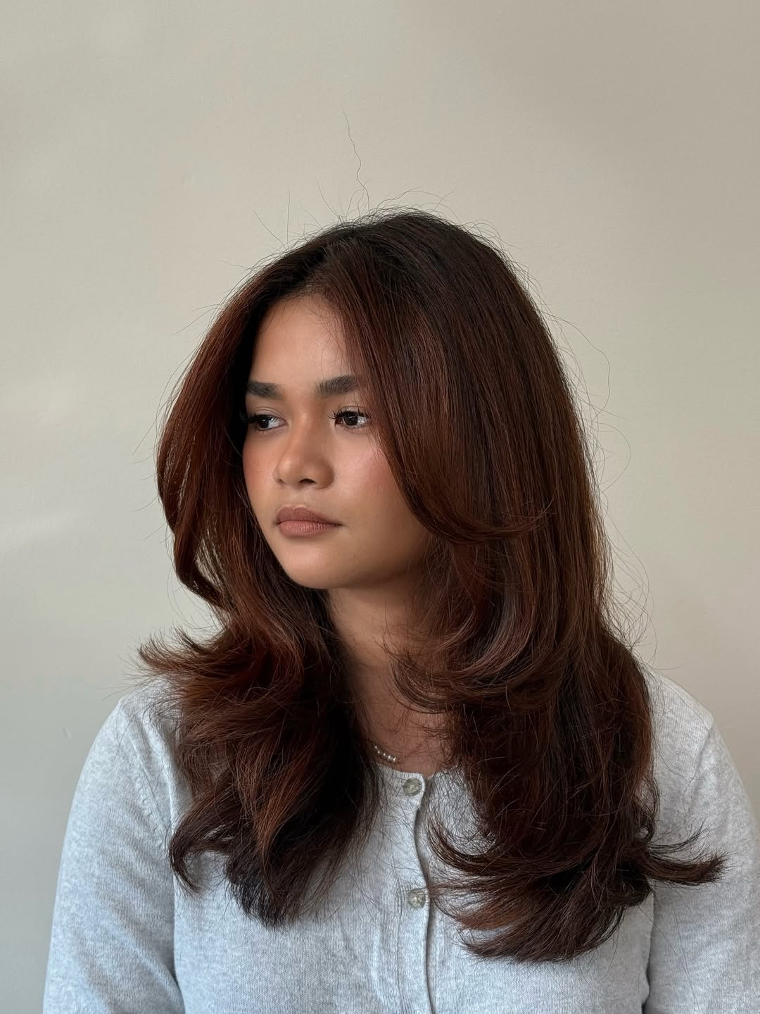 Rich Reddish-Brown Feathered Layers for Medium Hair
