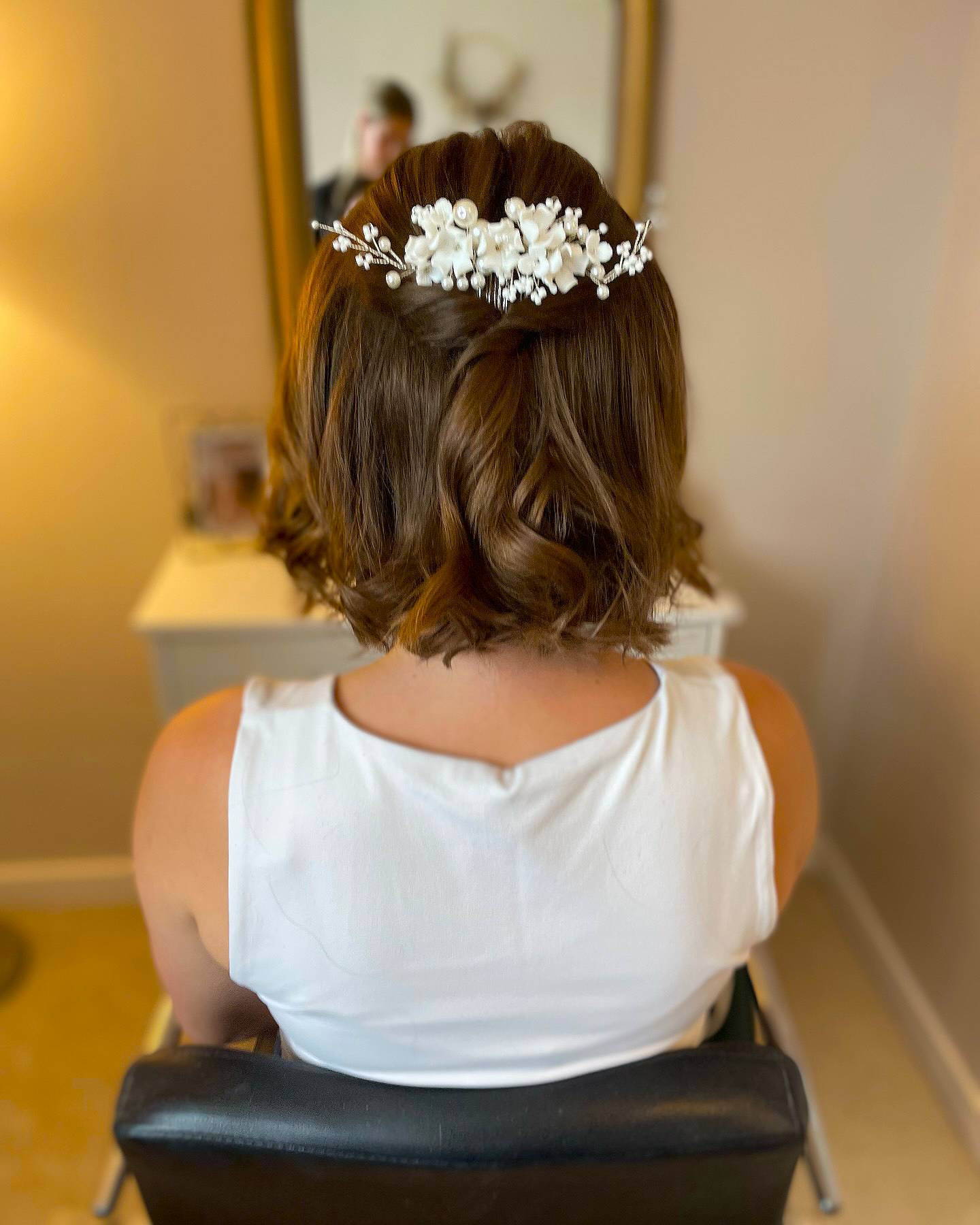 Romantic Curly Bob with Floral Accent