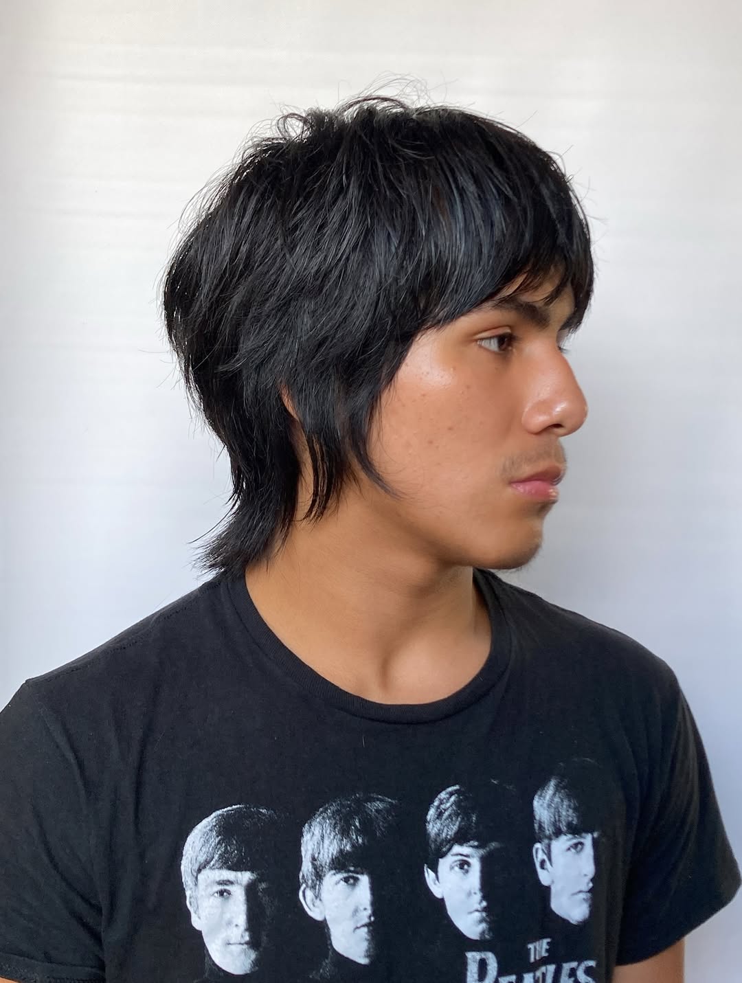 Slick Side-Parted Mod Cut with Soft End Curls