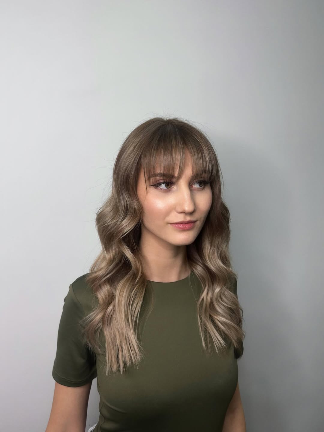 Soft Beige Blonde Waves with Feathered Bangs
