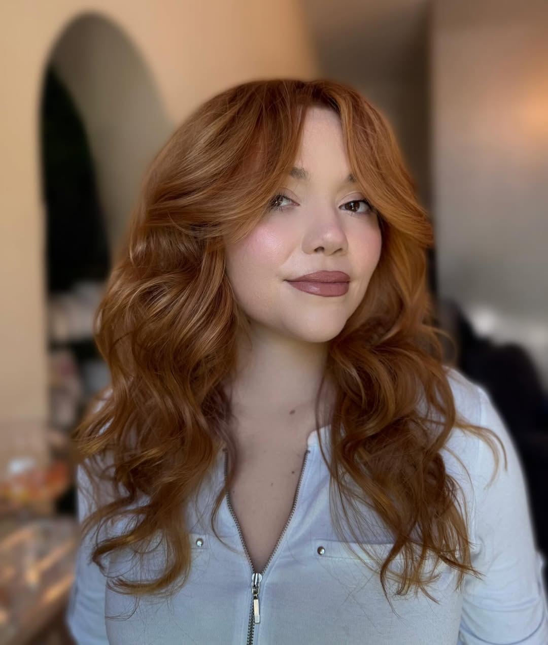 Soft Copper Curls with Mid-Length Feathered Layers
