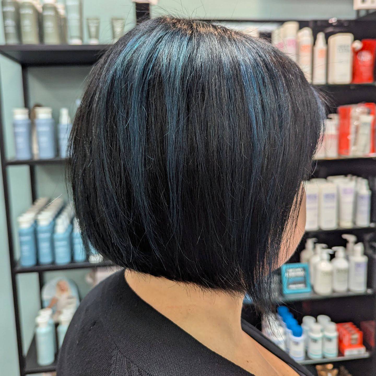Bold Black Inverted Bob with Teal Highlights
