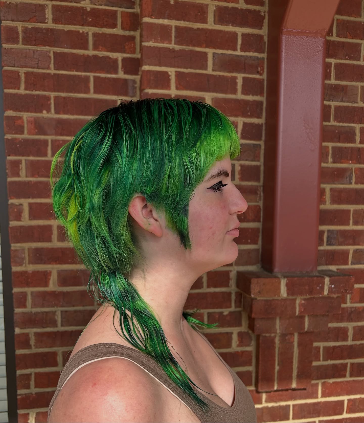 Emerald-Green Choppy Layered Bob with Tapered Back