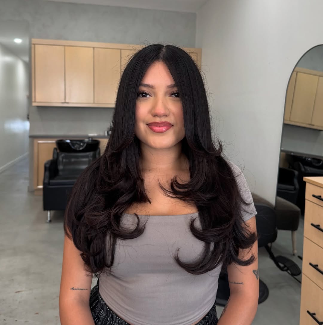 Glossy Black Cascading Curls with Subtle Layers