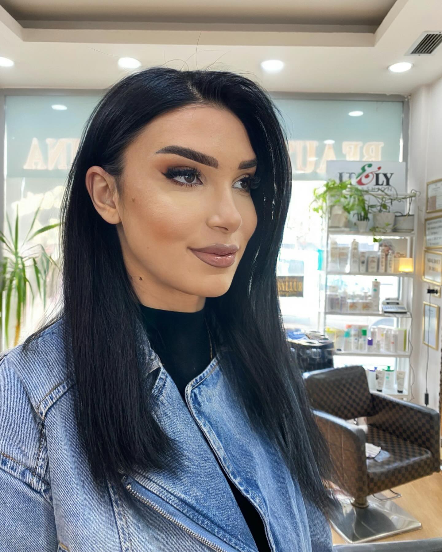 Jet-Black Sharp Mid-Length Cut with Feathered Ends