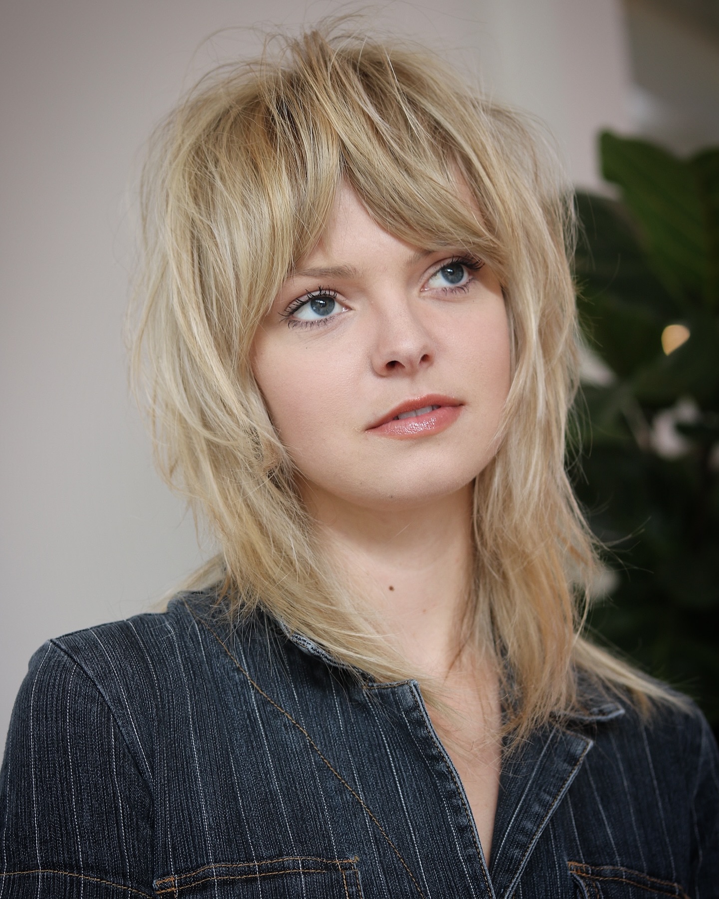Playful Blonde Shag with Wispy Bangs
