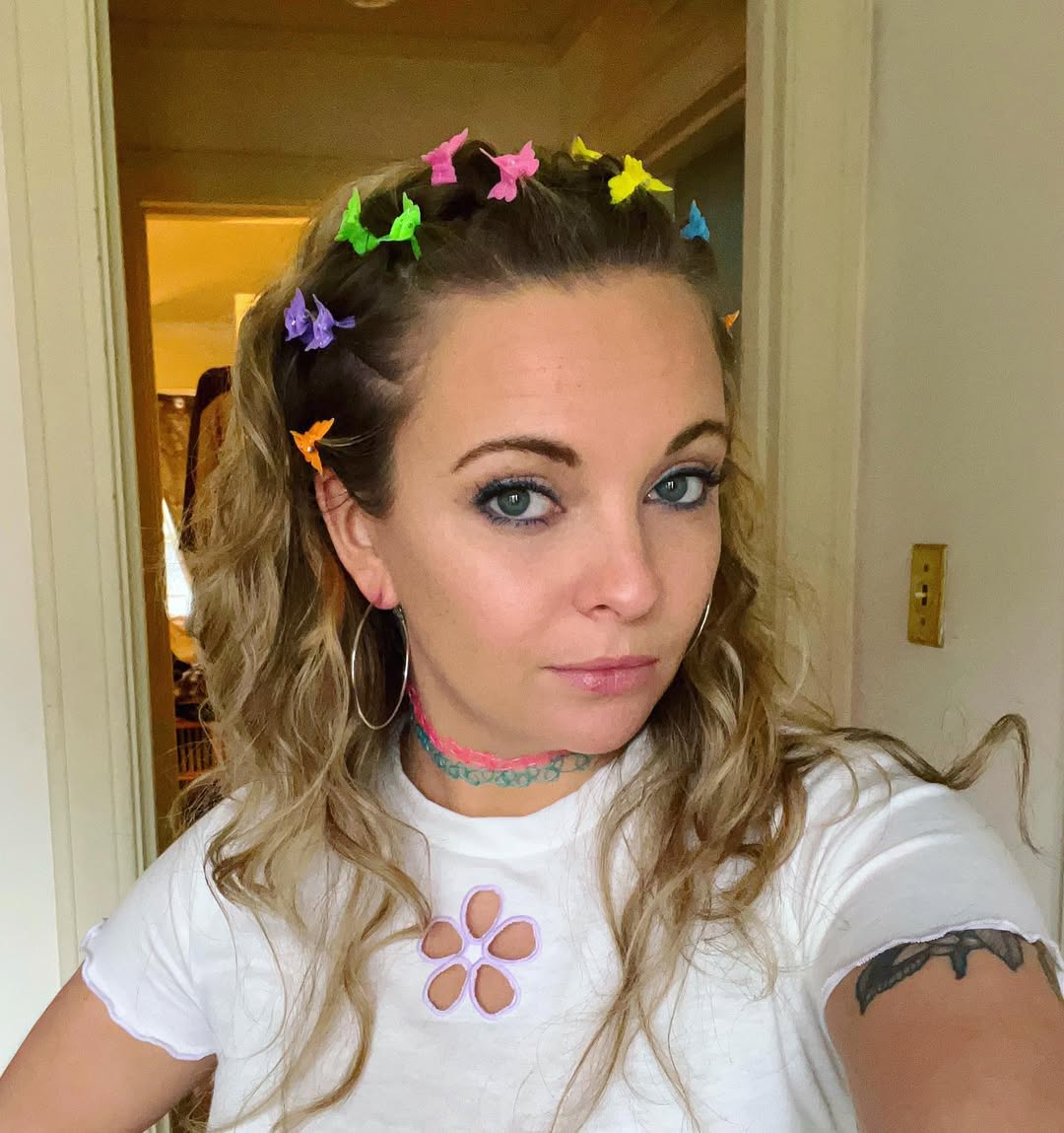 Playful Twisted Half-Updo with Colorful Butterfly Clips