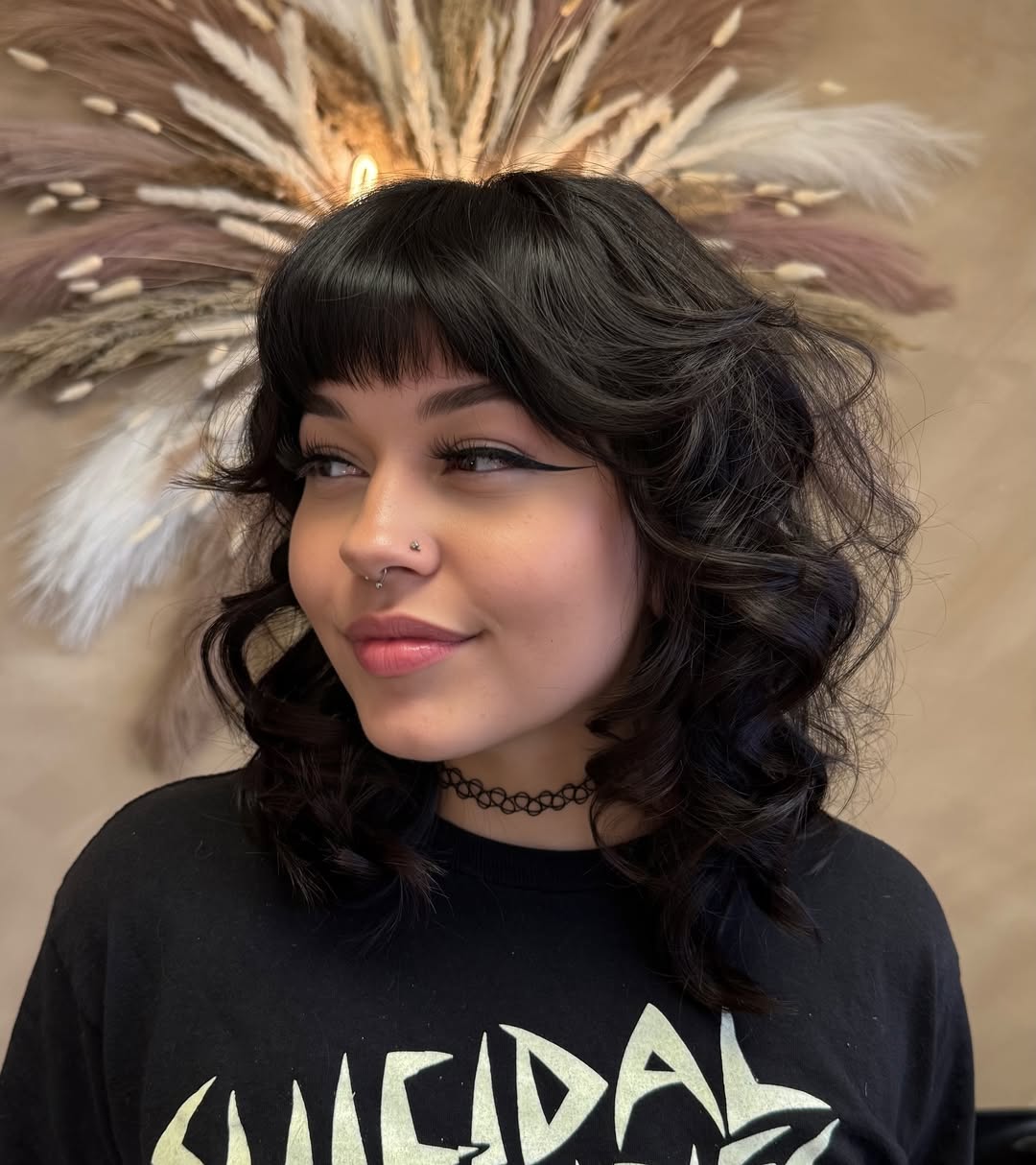 Retro-Inspired Voluminous Curls with Full Fringe