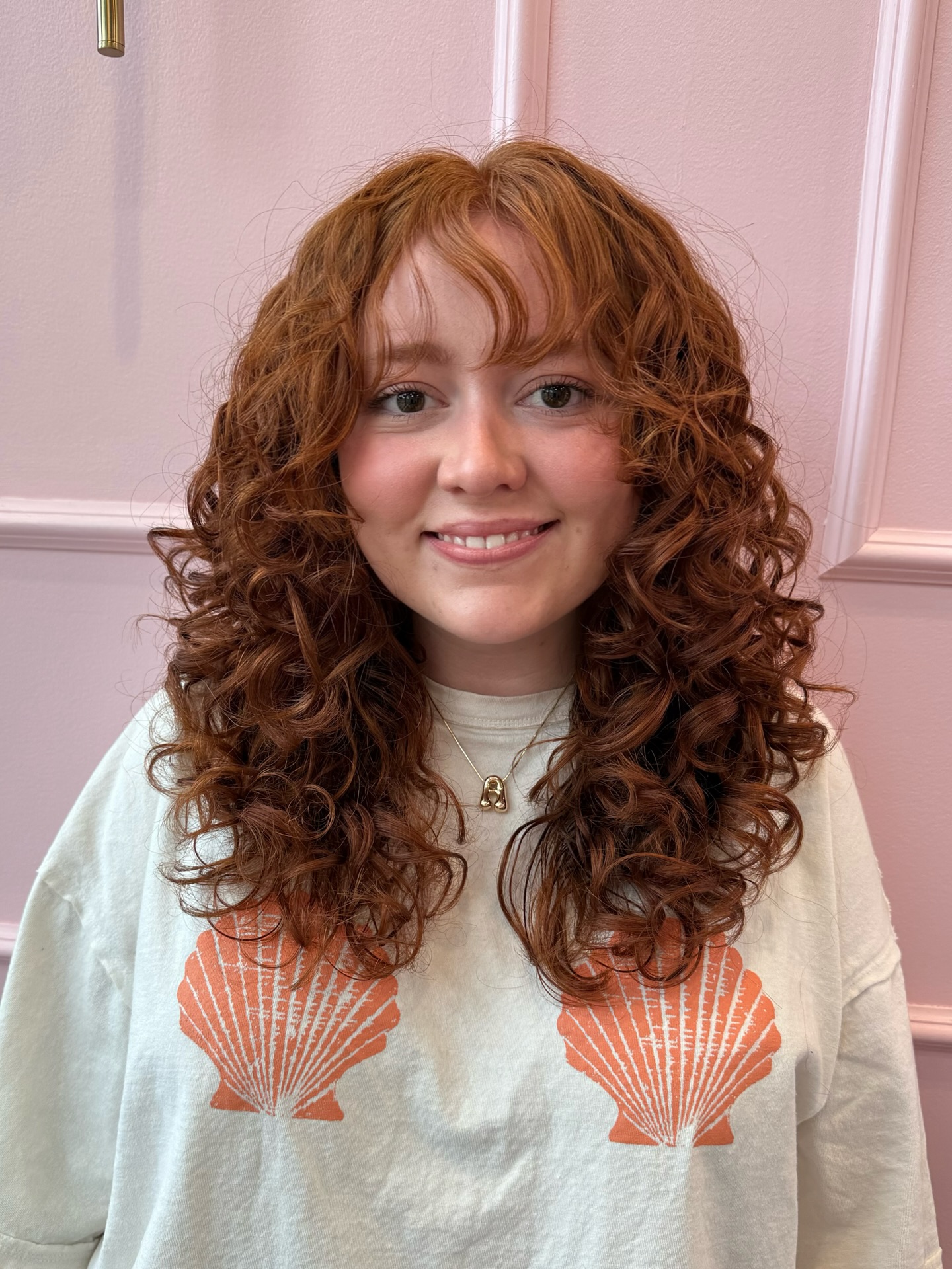 Rich Copper Shoulder-Length Curls with Subtle Layers