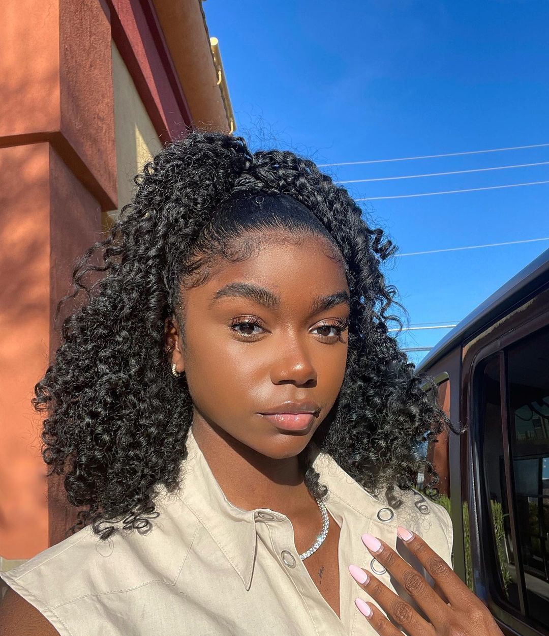 Sculpted Shoulder-Length Curls with Elegant Headband Twist