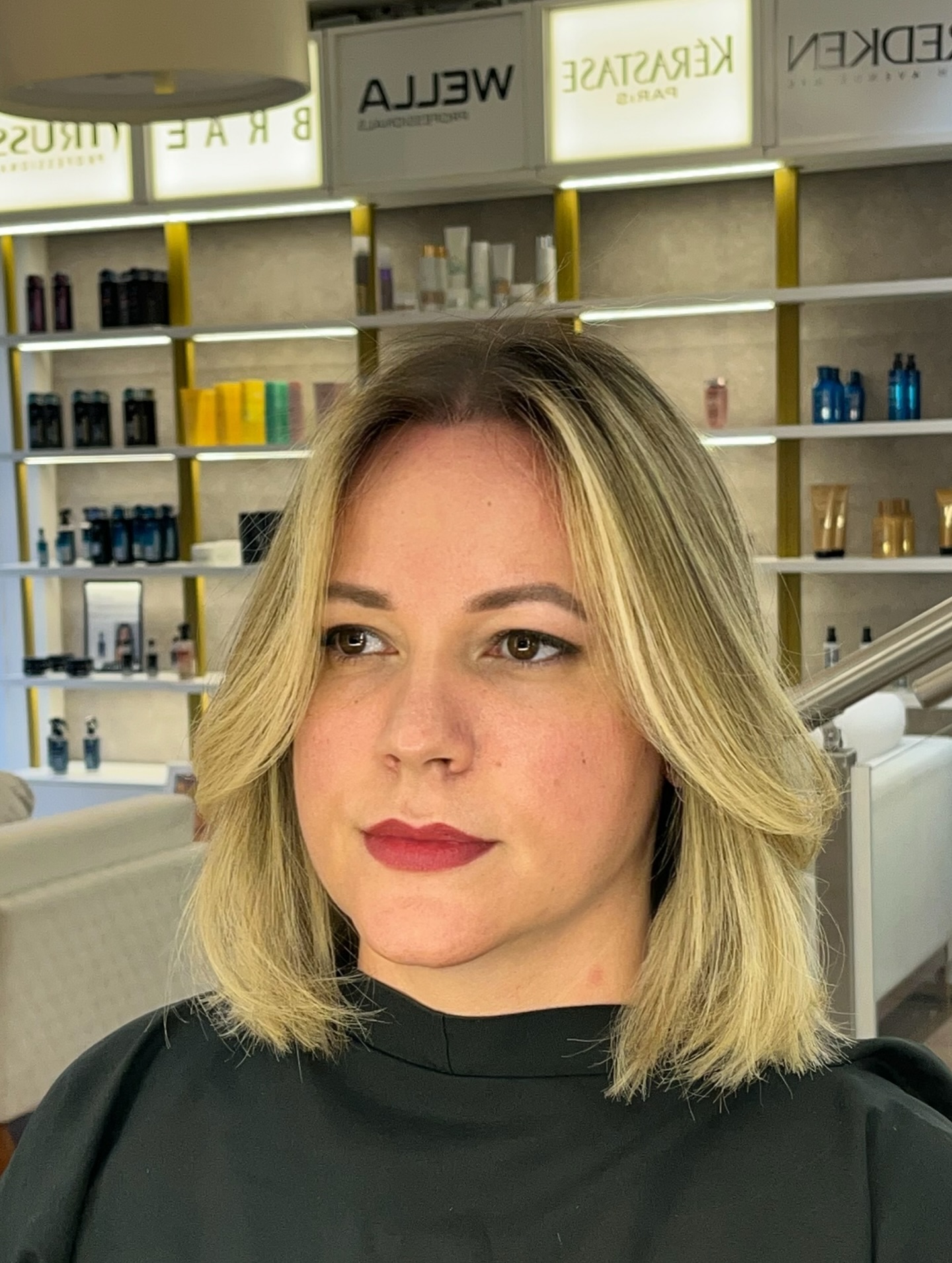 Sleek Blonde Graduated Bob with Dark Roots