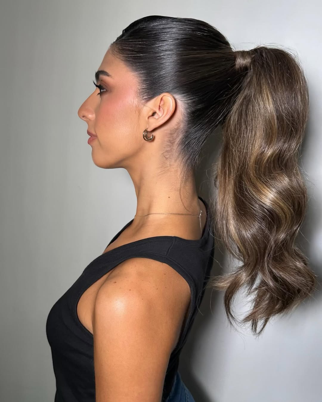 Sleek Chestnut Ponytail with Cascading Waves