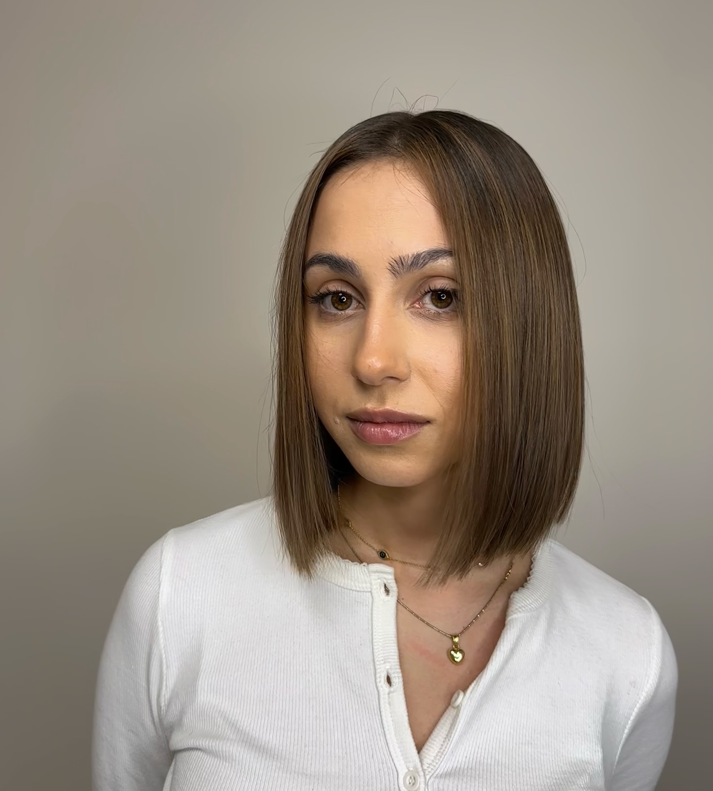 Sleek Mid-Length Cut with Subtle Face-Framing