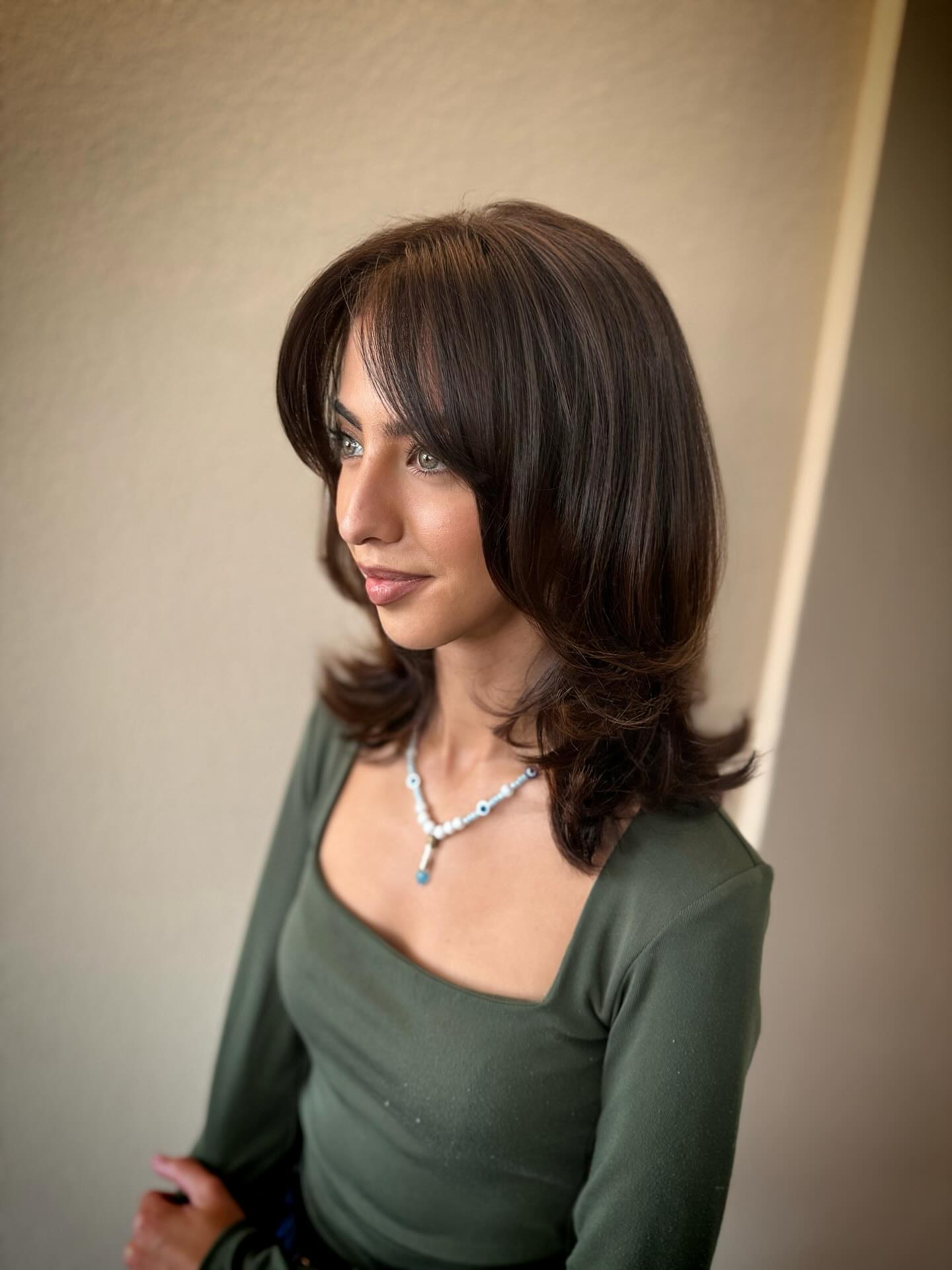 Sleek Mid-Length Cut with Voluminous Layers