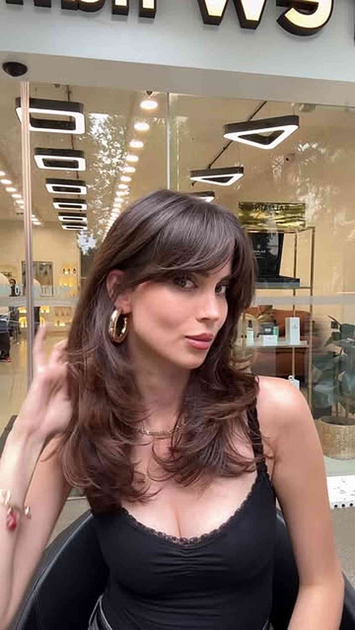 Stylish Layered Curtain Bangs with Soft Waves