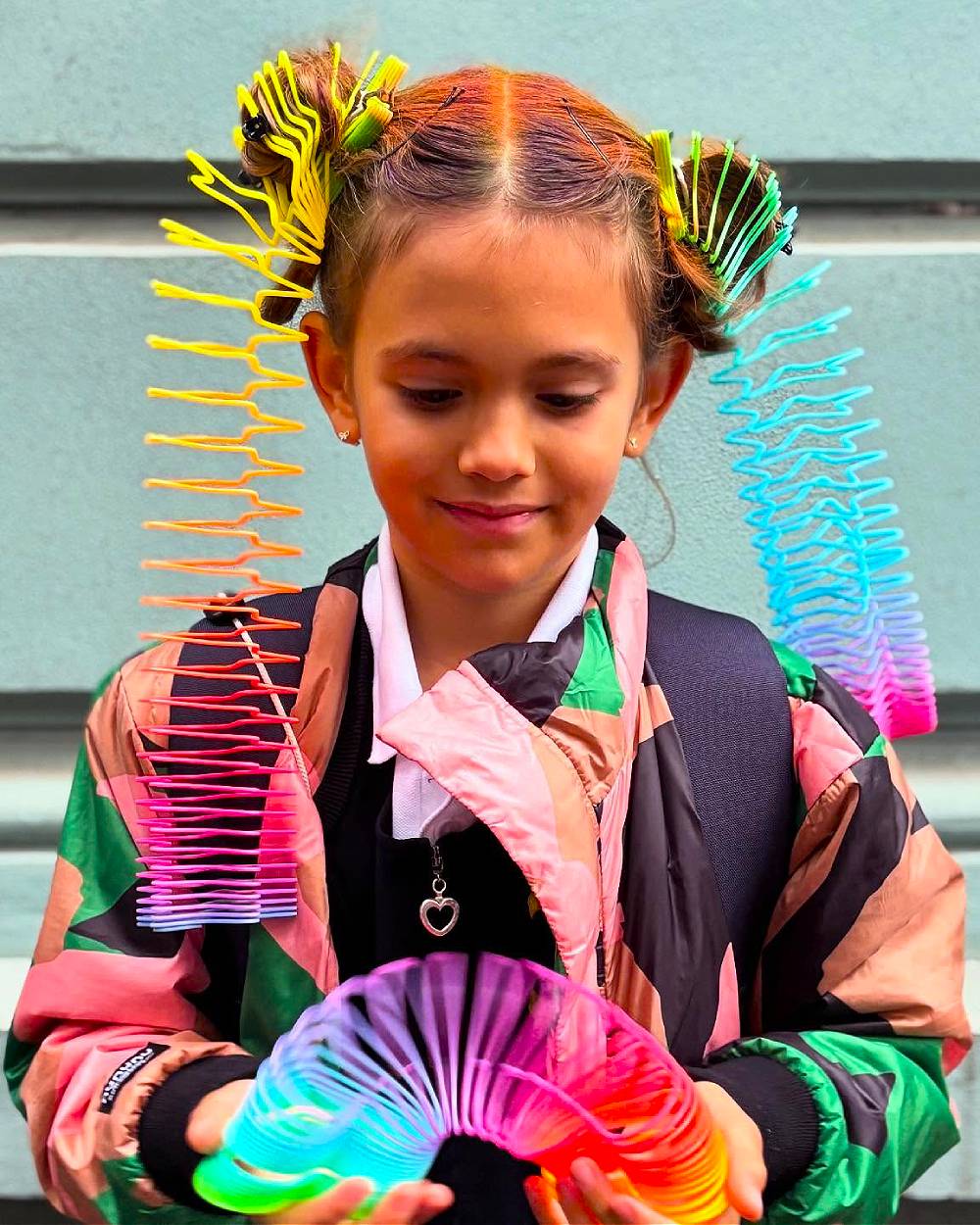Vibrant Rainbow Comb Buns with Playful Accents