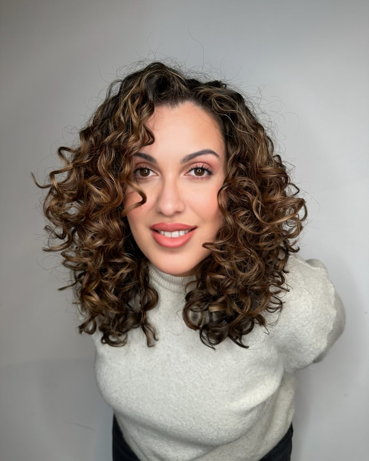 Voluminous Shoulder-Length Spiral Curls