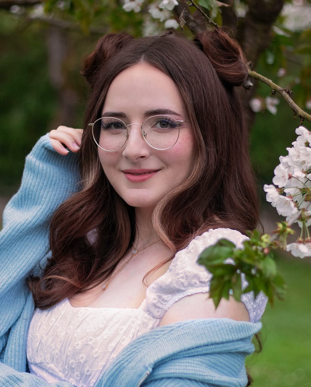Whimsical Chestnut Double Buns with Flowing Waves