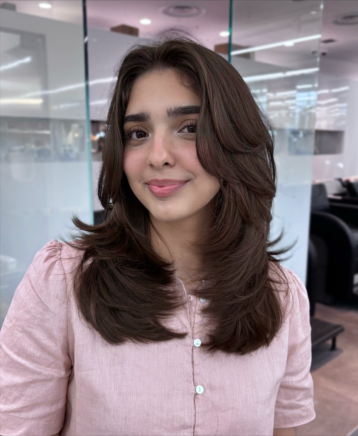 Brunette Feathered Layers with Soft Waves