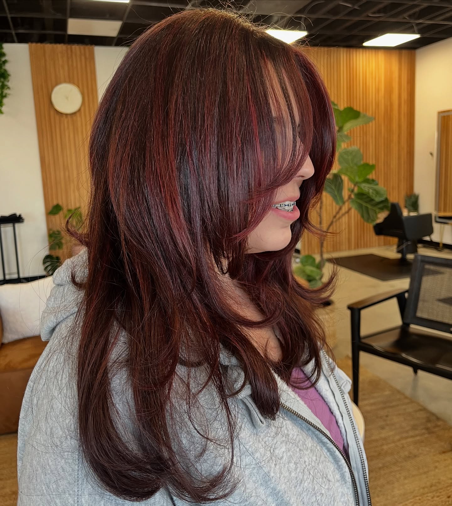 Burgundy-Red-Flowing-Layers-with-Side-Swept-Bangs