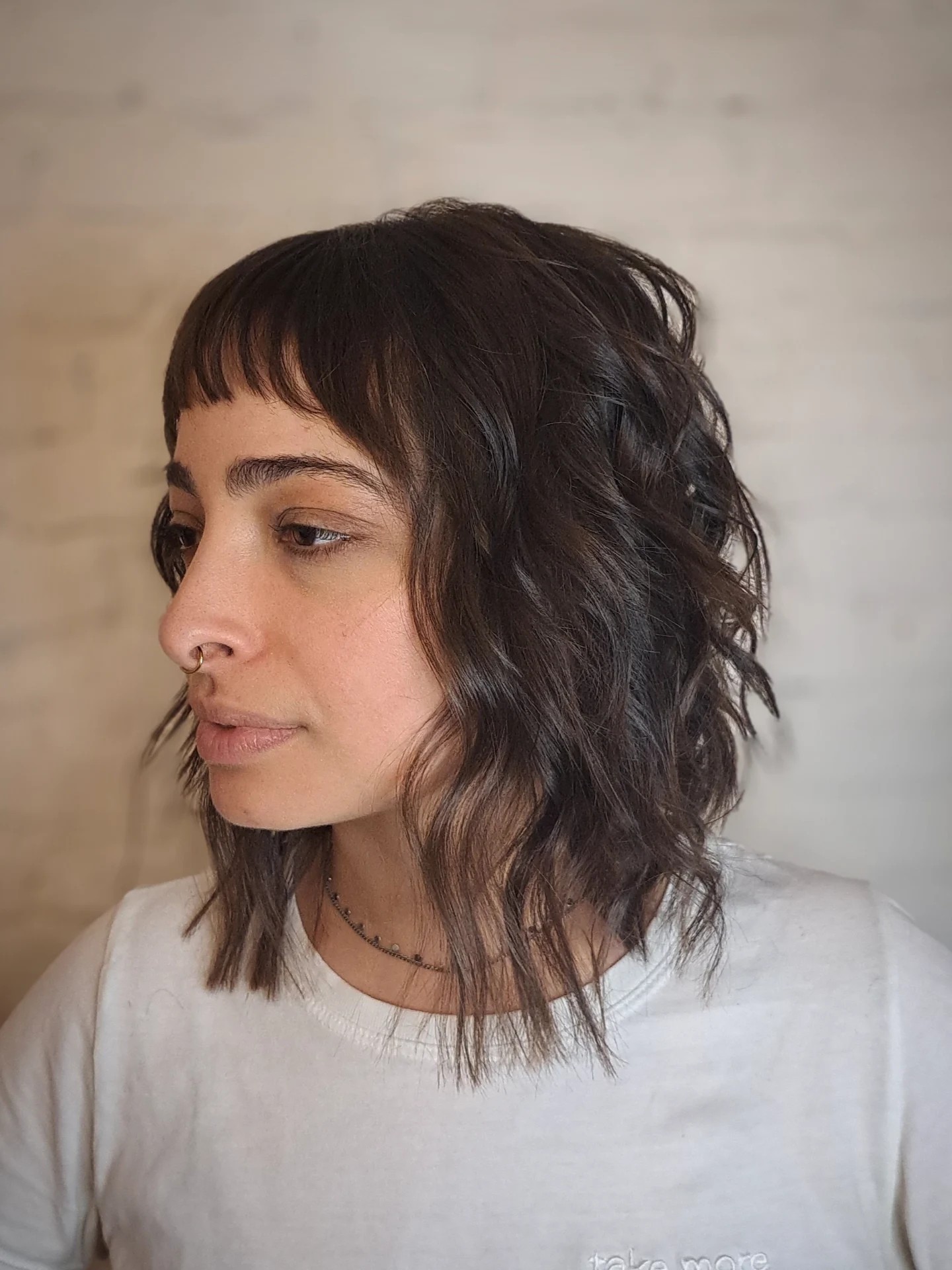 Deep Brunette Wavy Shag with Soft Bangs